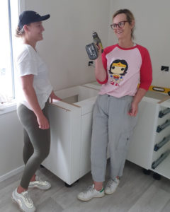 Kristina teaching our daughter Izzy the art of installing a kitchen! 